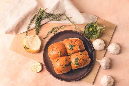 Fresh bread with garlic on color backgroundの写真素材
