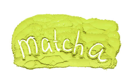 Word MATCHA written on powdered green tea on white background