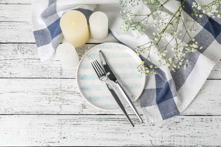 Beautiful table setting on light background