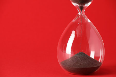 Hourglass on color background. Time management concept