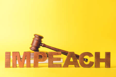 Word IMPEACH, judge gavel, money and book on color backgroundの写真素材