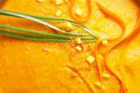 Tasty carrot cream soup, closeup