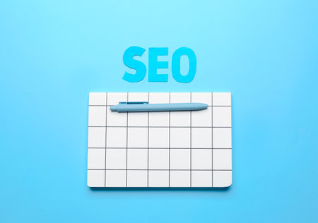 Abbreviation SEO with notebook and pen on color backgroundの写真素材