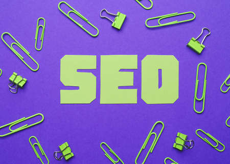 Abbreviation SEO with stationery on color backgroundの写真素材