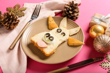 Tasty sandwich in shape of bull on festive table settingの写真素材