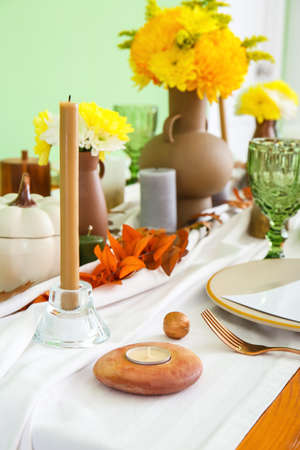 Beautiful table setting for Thanksgiving Day celebration in dining roomの写真素材