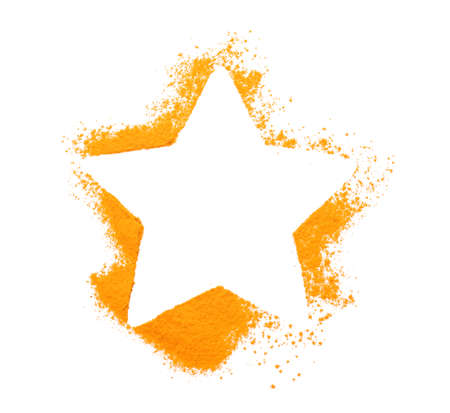 Star shape made of turmeric powder on white backgroundの写真素材