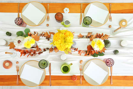 Beautiful table setting for Thanksgiving Day celebration in dining roomの写真素材