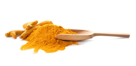 Scoop with turmeric powder and roots on white backgroundの写真素材