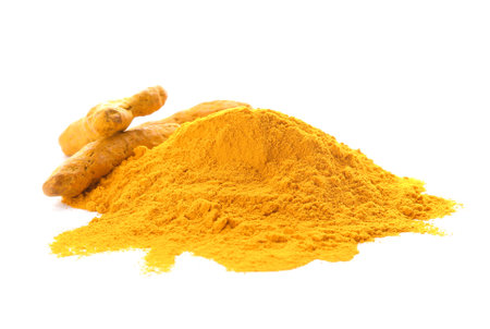 Heap with turmeric powder and roots on white backgroundの写真素材