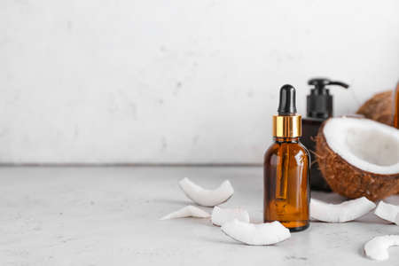 Composition with bottle of coconut oil on light backgroundの写真素材
