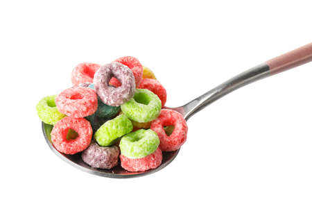 Spoon with tasty cereal rings on white background, closeup