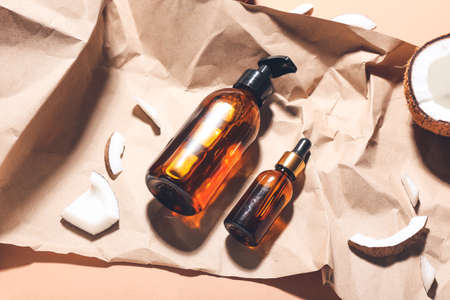 Composition with bottles of coconut oil on color backgroundの写真素材