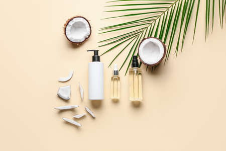 Composition with bottles of coconut oil on color backgroundの写真素材