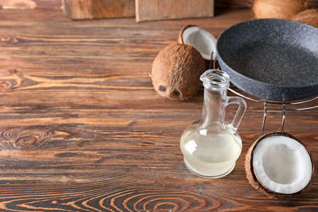 Decanter of coconut oil on wooden backgroundの写真素材