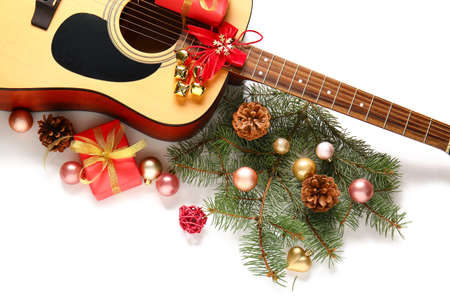 Guitar and Christmas decor on white backgroundの写真素材