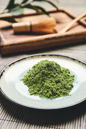Plate with powdered matcha tea on table, closeupの写真素材