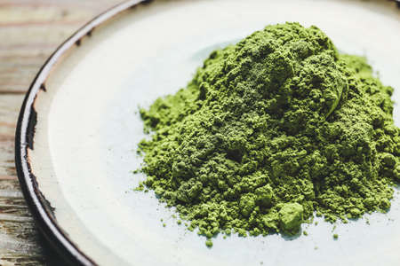 Plate with powdered matcha tea, closeupの写真素材