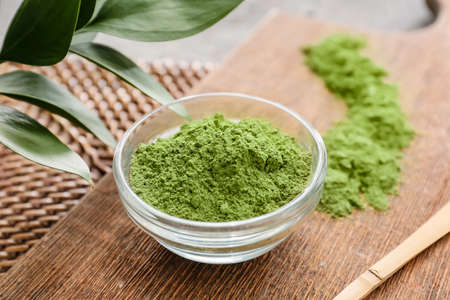 Bowl with powdered matcha tea on table, closeupの写真素材