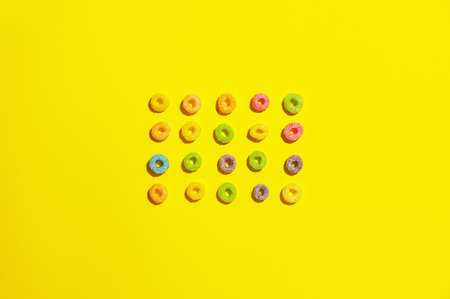 Tasty cereal rings on color backgroundの写真素材