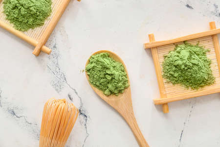 Composition with powdered matcha tea on light backgroundの写真素材