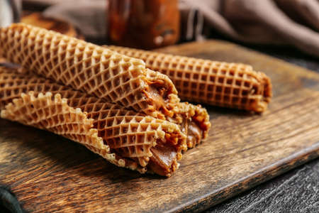 Tasty wafer rolls with boiled condensed milk, closeupの写真素材
