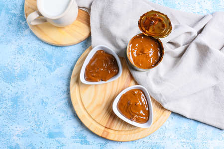 Boiled condensed milk on color backgroundの写真素材