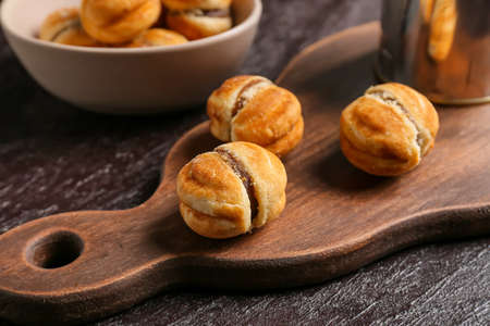 Tasty cookies with boiled condensed milk on dark backgroundの写真素材