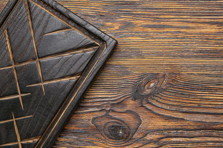 Cutting board on wooden background
