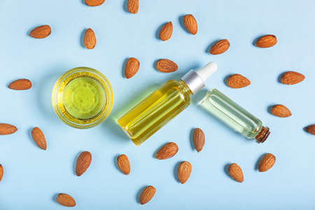 Composition with almond oil on color background, closeupの写真素材