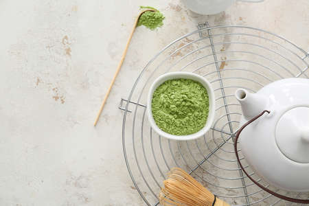 Composition with powdered matcha tea on light backgroundの写真素材