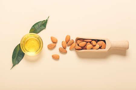 Composition with almond oil on color backgroundの写真素材