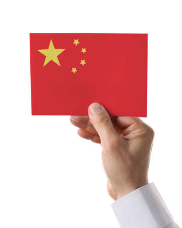 Male hand with paper Chinese flag on white backgroundの写真素材