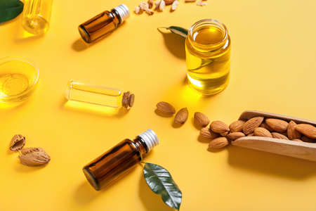 Composition with almond oil on color backgroundの写真素材
