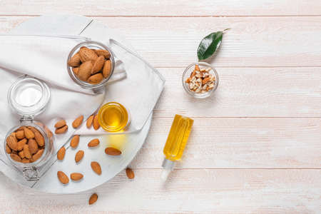 Composition with almond oil on light wooden backgroundの写真素材