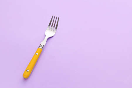 Stylish fork on color backgroundの写真素材