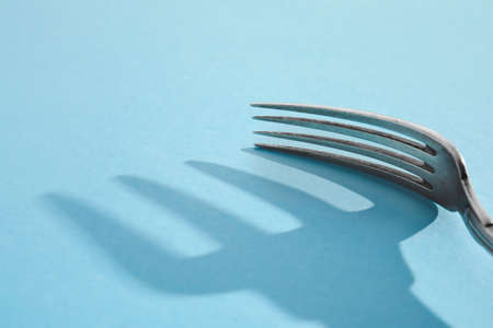 Stylish fork on color backgroundの写真素材
