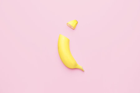 Tasty cut banana on color backgroundの写真素材