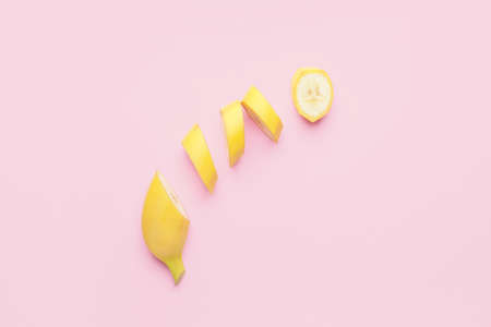 Tasty cut banana on color backgroundの写真素材