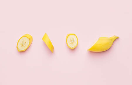 Tasty cut banana on color backgroundの写真素材