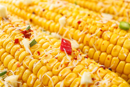 Tasty baked corn cobs as background