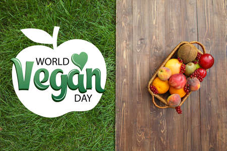 Greeting card for World Vegan Day with fresh fruitsの写真素材