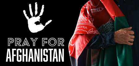 Man with flag and text PRAY FOR AFGHANISTAN on dark backgroundの写真素材