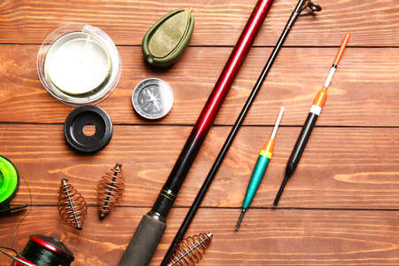 Different fishing equipment on wooden backgroundの写真素材