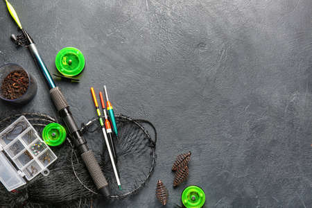 Different fishing equipment on dark backgroundの写真素材