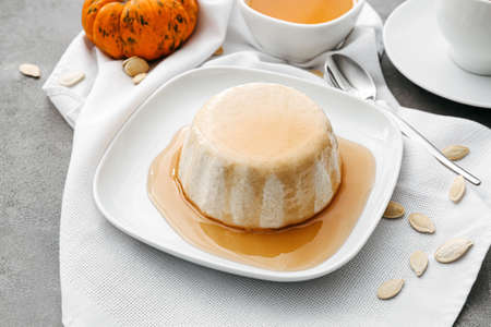 Tasty pumpkin pudding on tableの写真素材