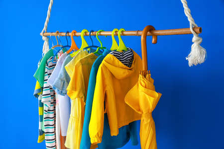 Rack with clothes in interior of children's roomの写真素材