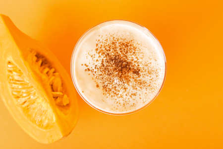 Glass of tasty pumpkin smoothie on color backgroundの写真素材