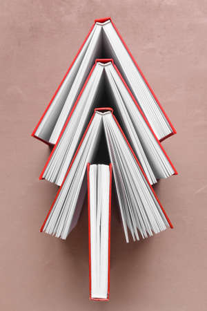Blank books on color background