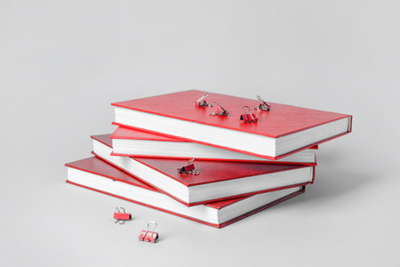 Blank books and stationery on light backgroundの写真素材